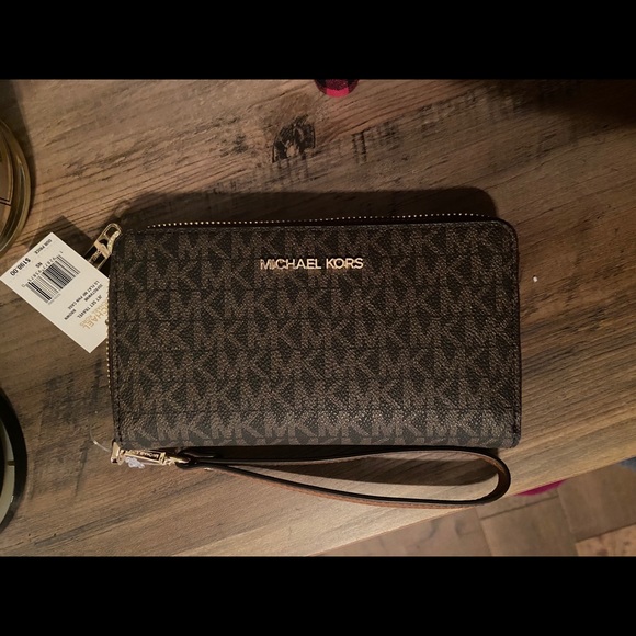 Michael Kors Brown phone wristlet.